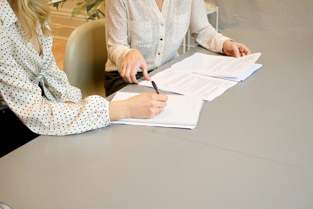 Compliance documents being reviewed and signed